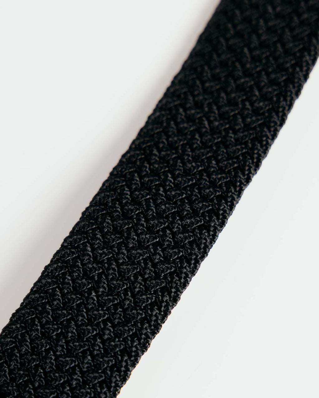 Primo Braided Golf Belt Black — woven elastic body texture close up