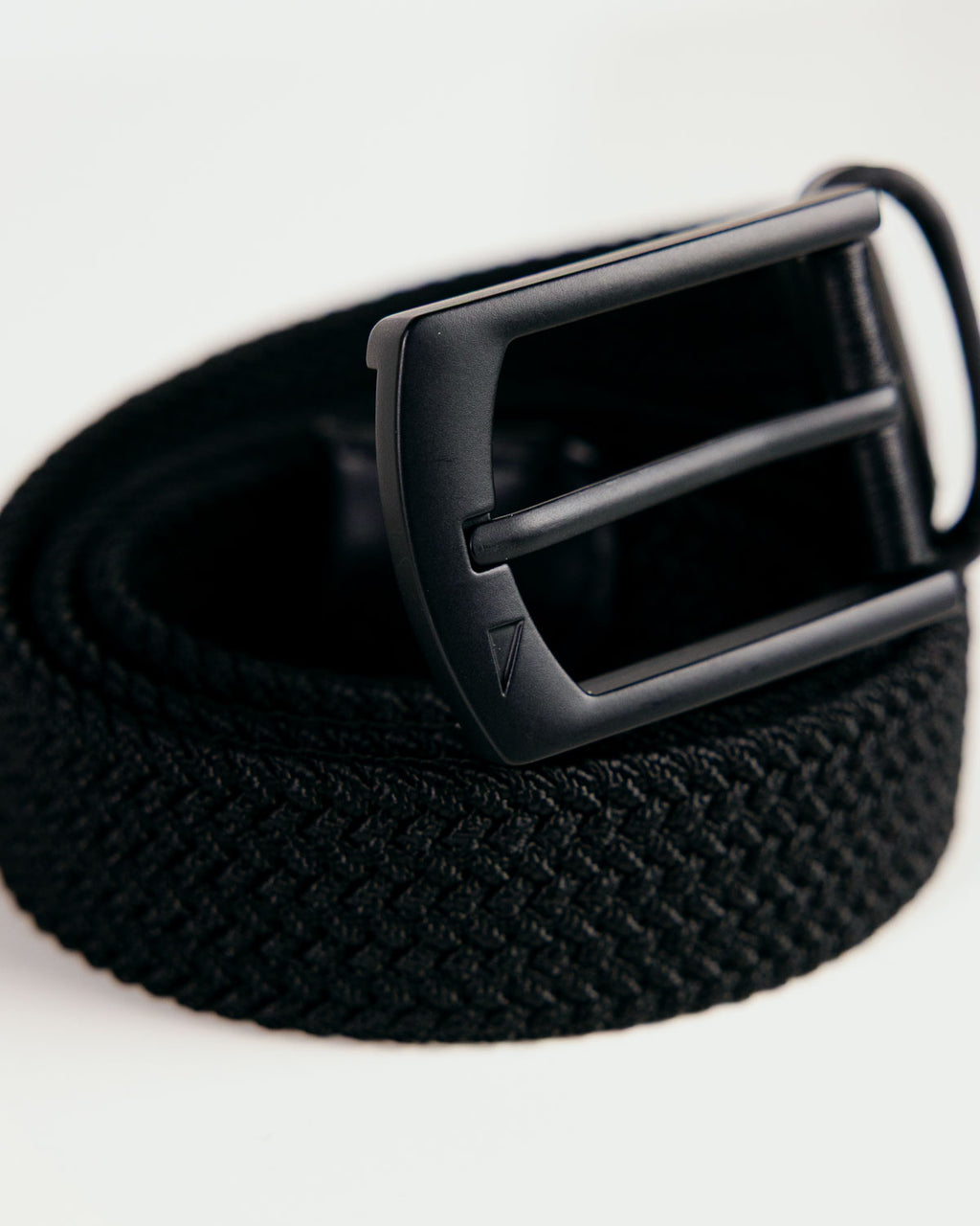 Primo Braided Golf Belt Black — angled coiled view with buckle