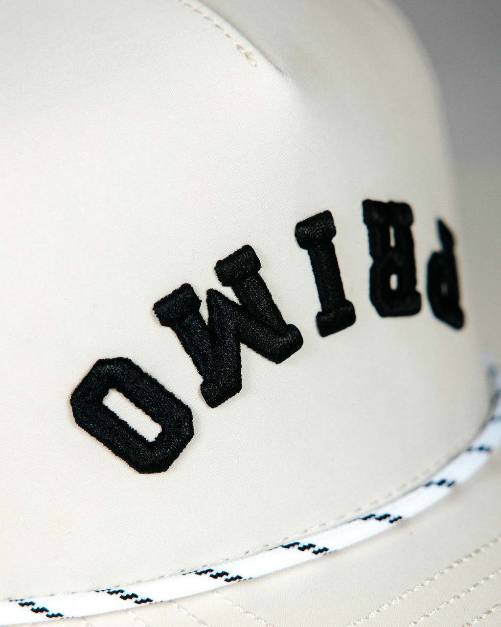 Primo Upside Down Hat Cream — perforated side panel with Primo rubber patch