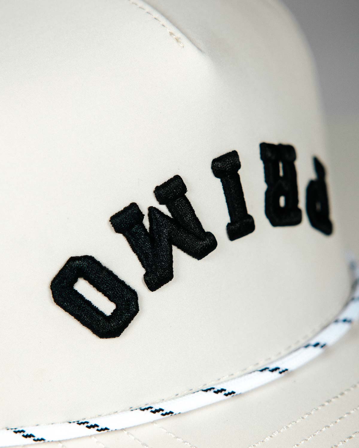 Primo Upside Down Hat Cream — perforated side panel with Primo rubber patch