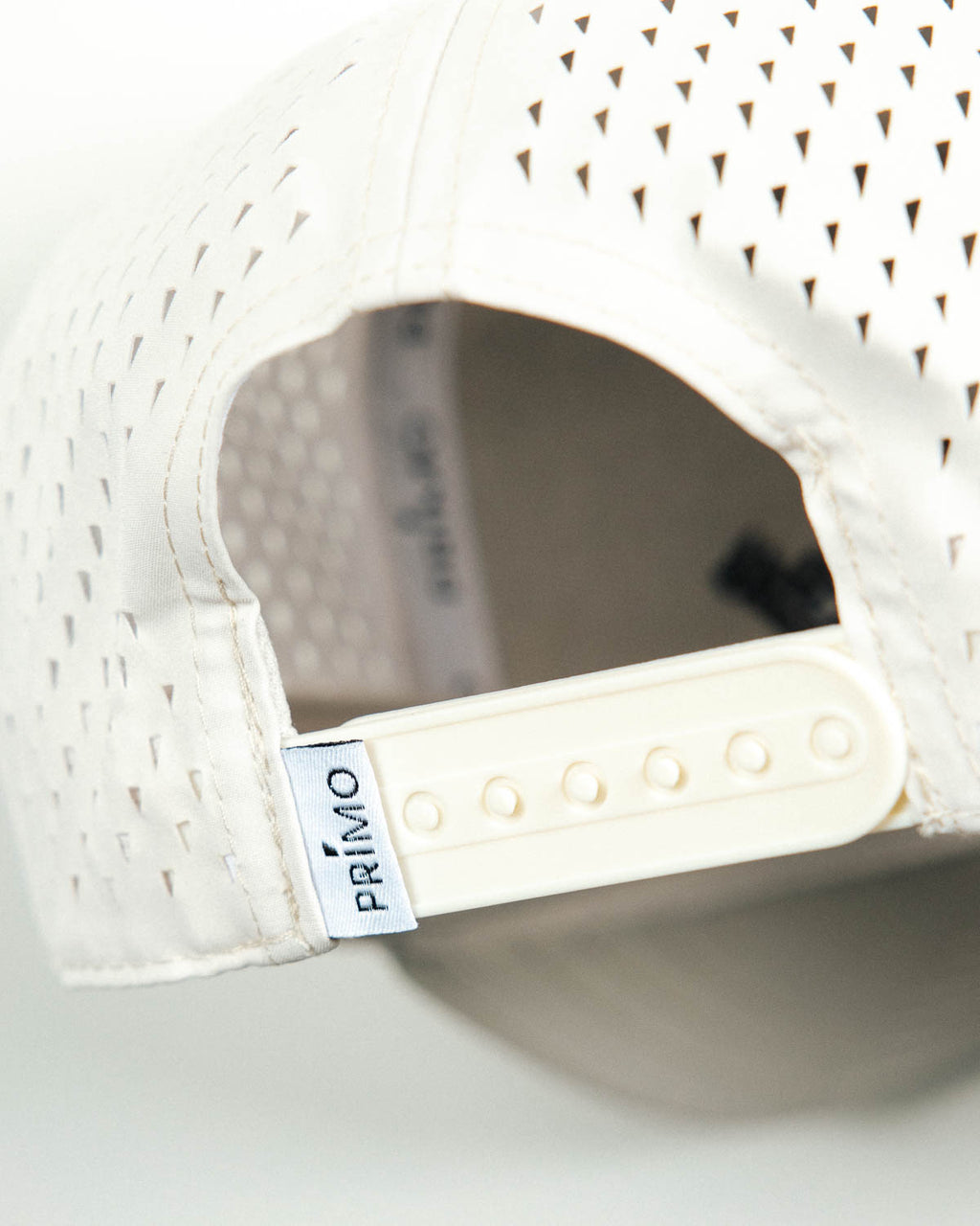 Primo Upside Down Hat Cream — back view showing snapback and perforated panels