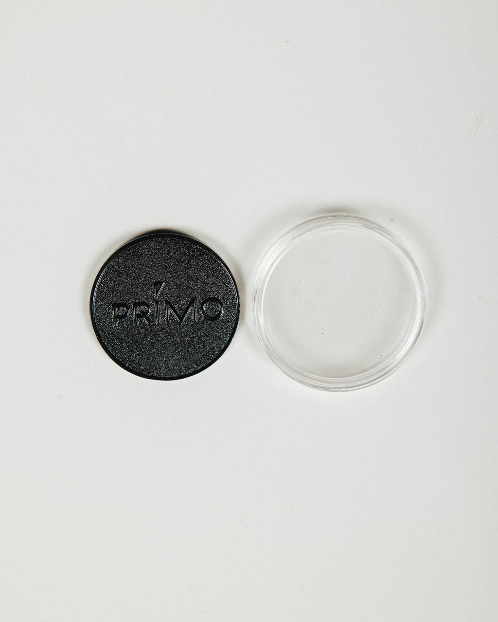 Primo Ball Markers scattered with cases