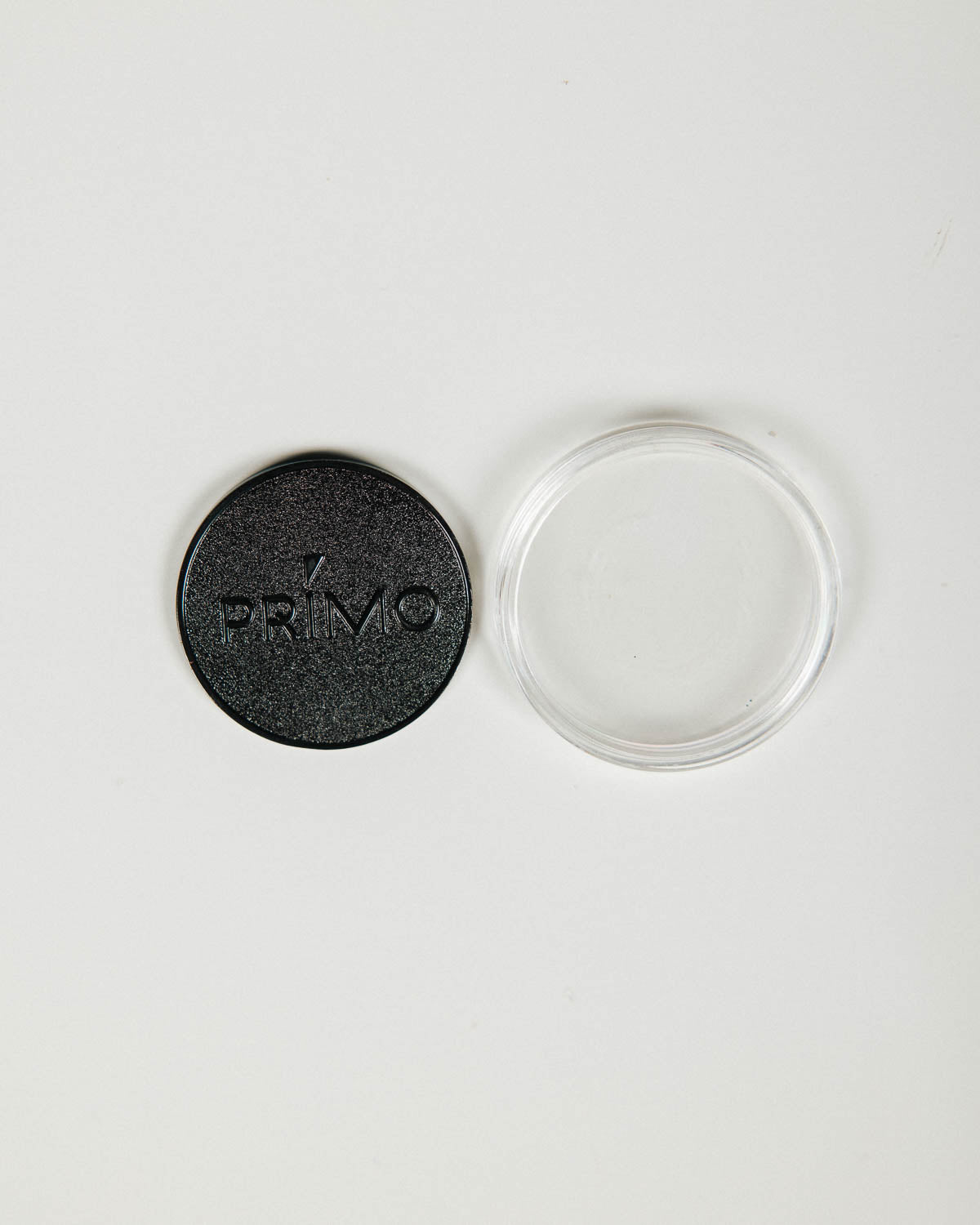 Primo Ball Markers scattered with cases